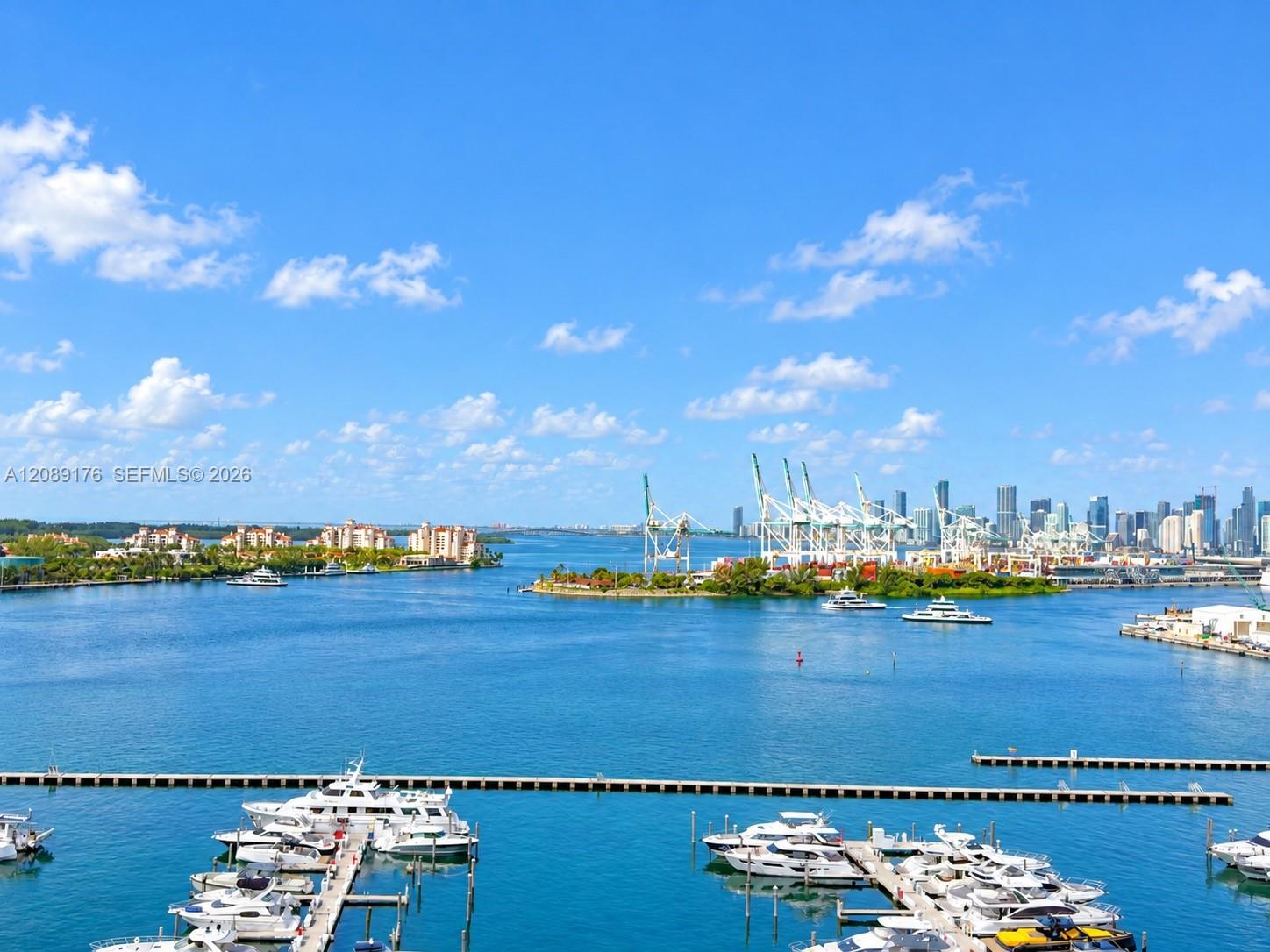 90 Alton Road, Unit 1710 Miami Beach, FL 33139 - Photo 1 of 16 Breathtaking open balcony view of Biscayne Bay, marina, and Miami Beach skyline