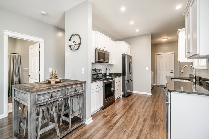 330 Billings Road Sparta, TN 38583 - Photo 8 of 28 a kitchen with stainless steel appliances granite countertop a sink stove and refrigerator