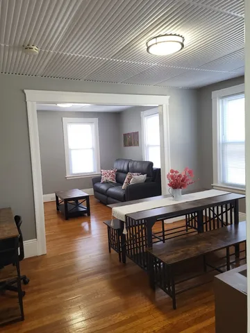 a living room with furniture and a table