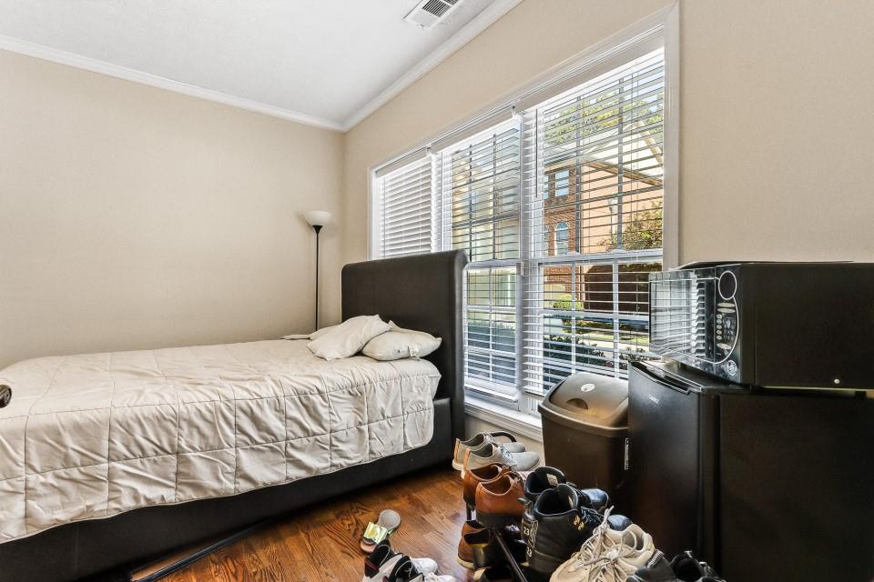 1946 Appaloosa Mill Circle Northeast Buford, GA 30519 - Photo 14 of 20 a bedroom with a bed and a flat screen tv
