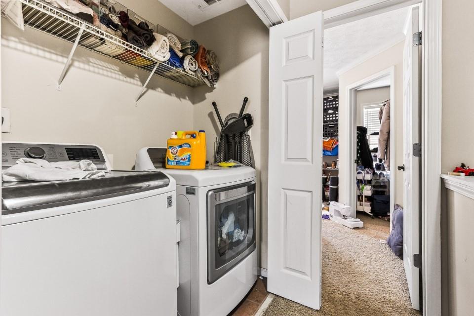 1946 Appaloosa Mill Circle Northeast Buford, GA 30519 - Photo 16 of 20 a utility room with dryer and washer