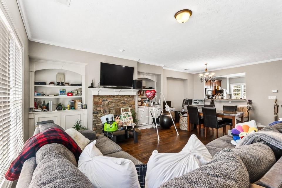 1946 Appaloosa Mill Circle Northeast Buford, GA 30519 - Photo 8 of 20 a living room with furniture and a flat screen tv