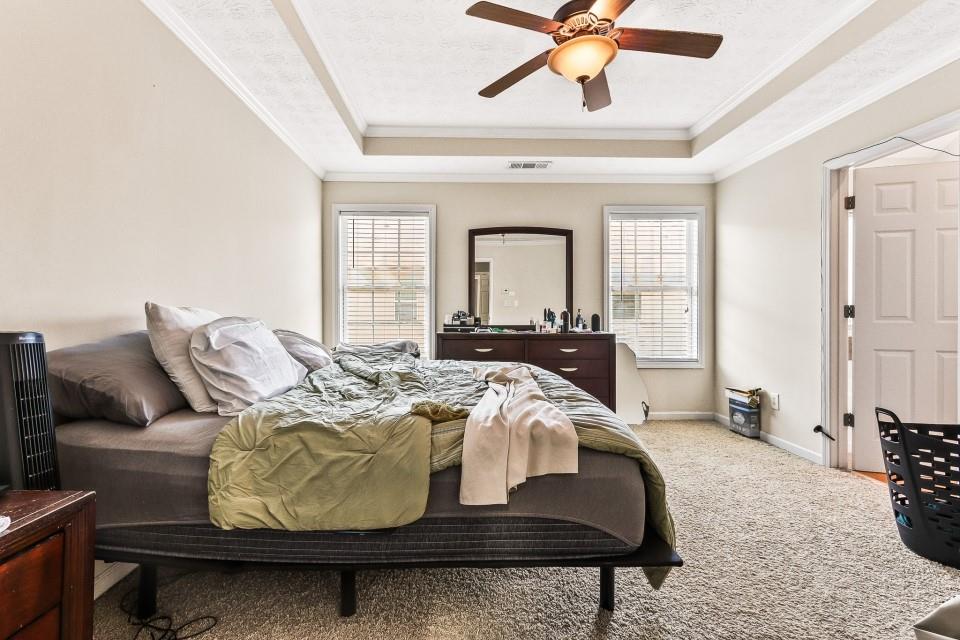 1946 Appaloosa Mill Circle Northeast Buford, GA 30519 - Photo 10 of 20 a bed room with a bed and a chair