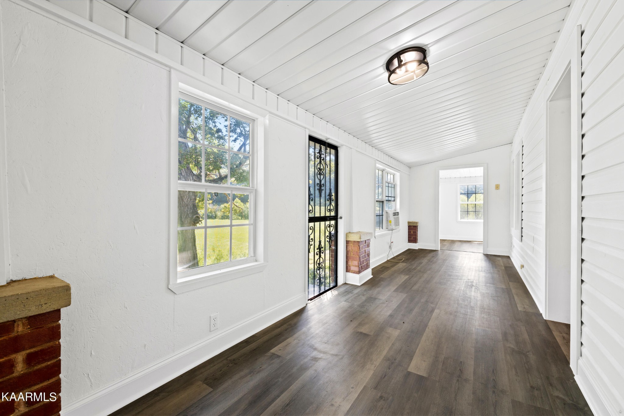 3044 Sims Road Sevierville, TN 37876 - Photo 12 of 34 a view of an empty room with wooden floor and a window