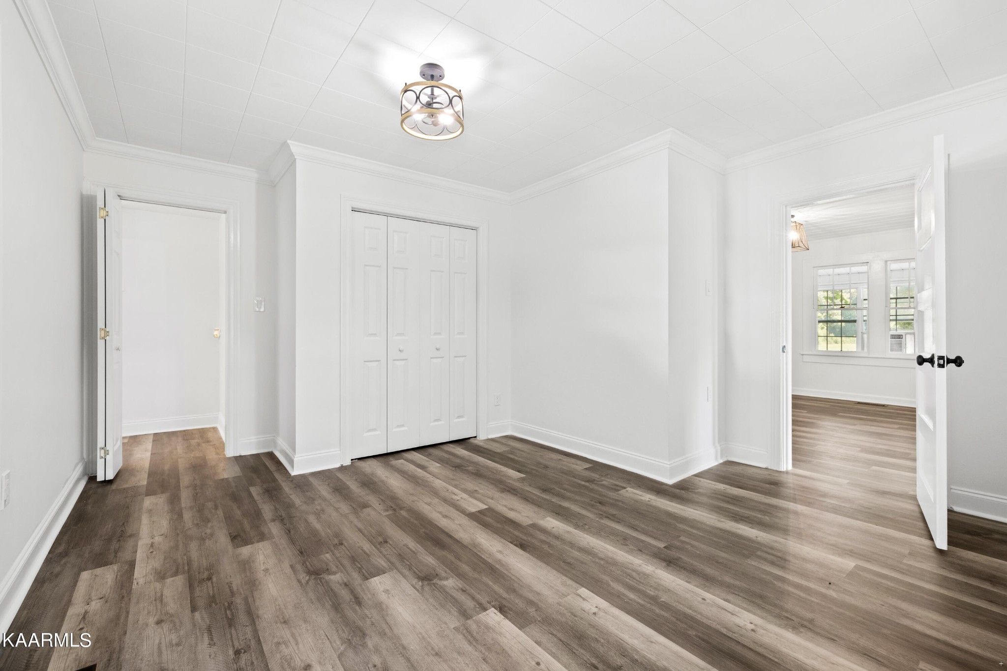 3044 Sims Road Sevierville, TN 37876 - Photo 16 of 34 an empty room with wooden floor and windows
