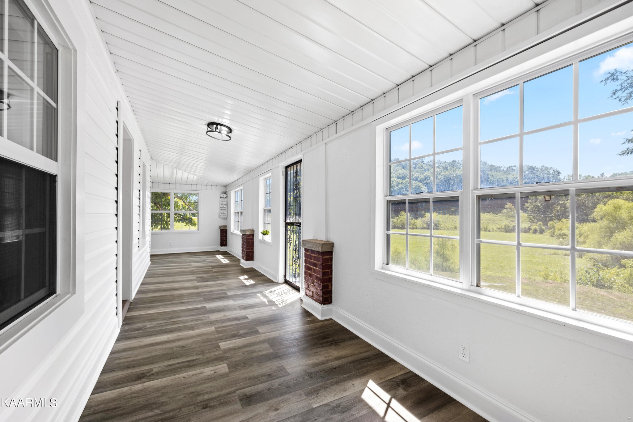 3044 Sims Road Sevierville, TN 37876 - Photo 18 of 34 a view of a patio with wooden floor and windows