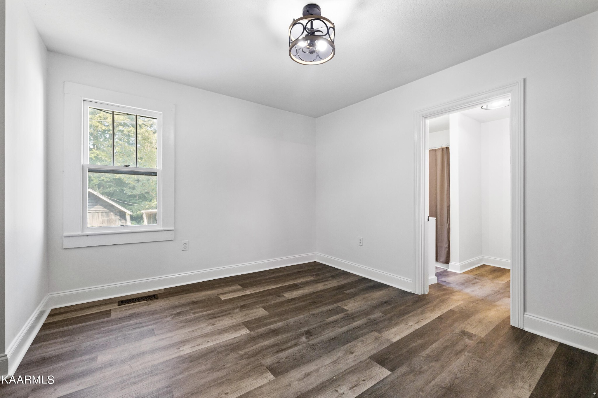 3044 Sims Road Sevierville, TN 37876 - Photo 20 of 34 wooden floor in an empty room with a window