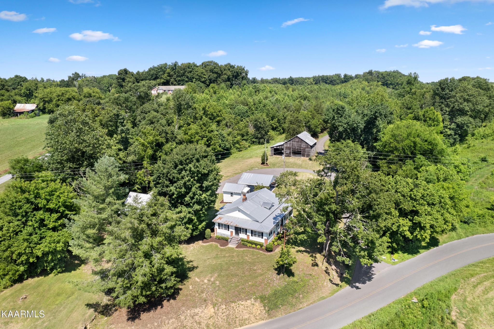 3044 Sims Road Sevierville, TN 37876 - Photo 2 of 34 an aerial view of a house with a yard
