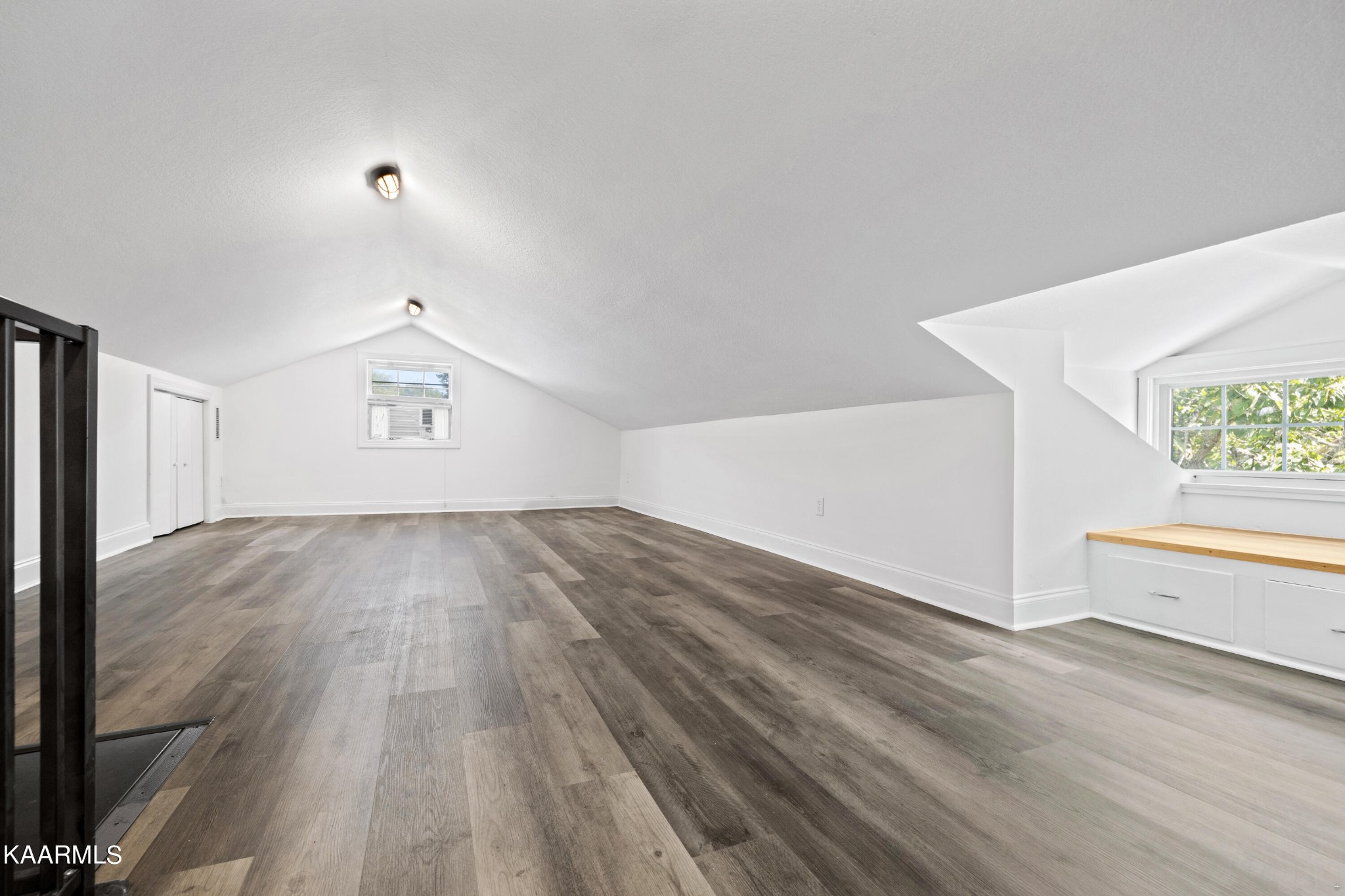 3044 Sims Road Sevierville, TN 37876 - Photo 23 of 34 an empty room with wooden floor and windows