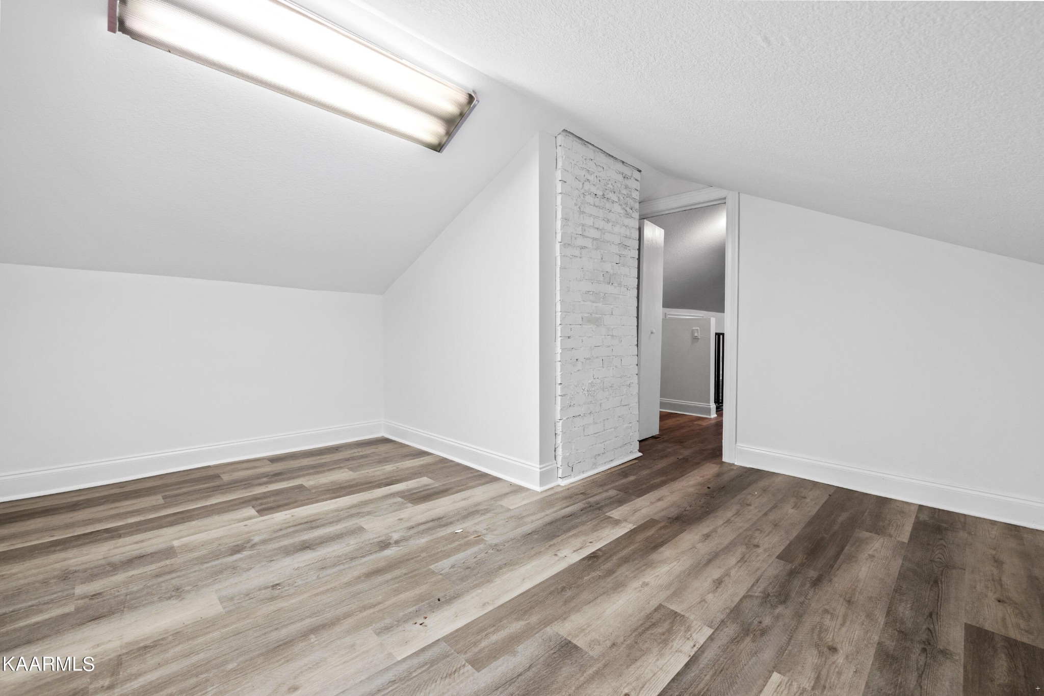 3044 Sims Road Sevierville, TN 37876 - Photo 25 of 34 a view of an empty room with wooden floor