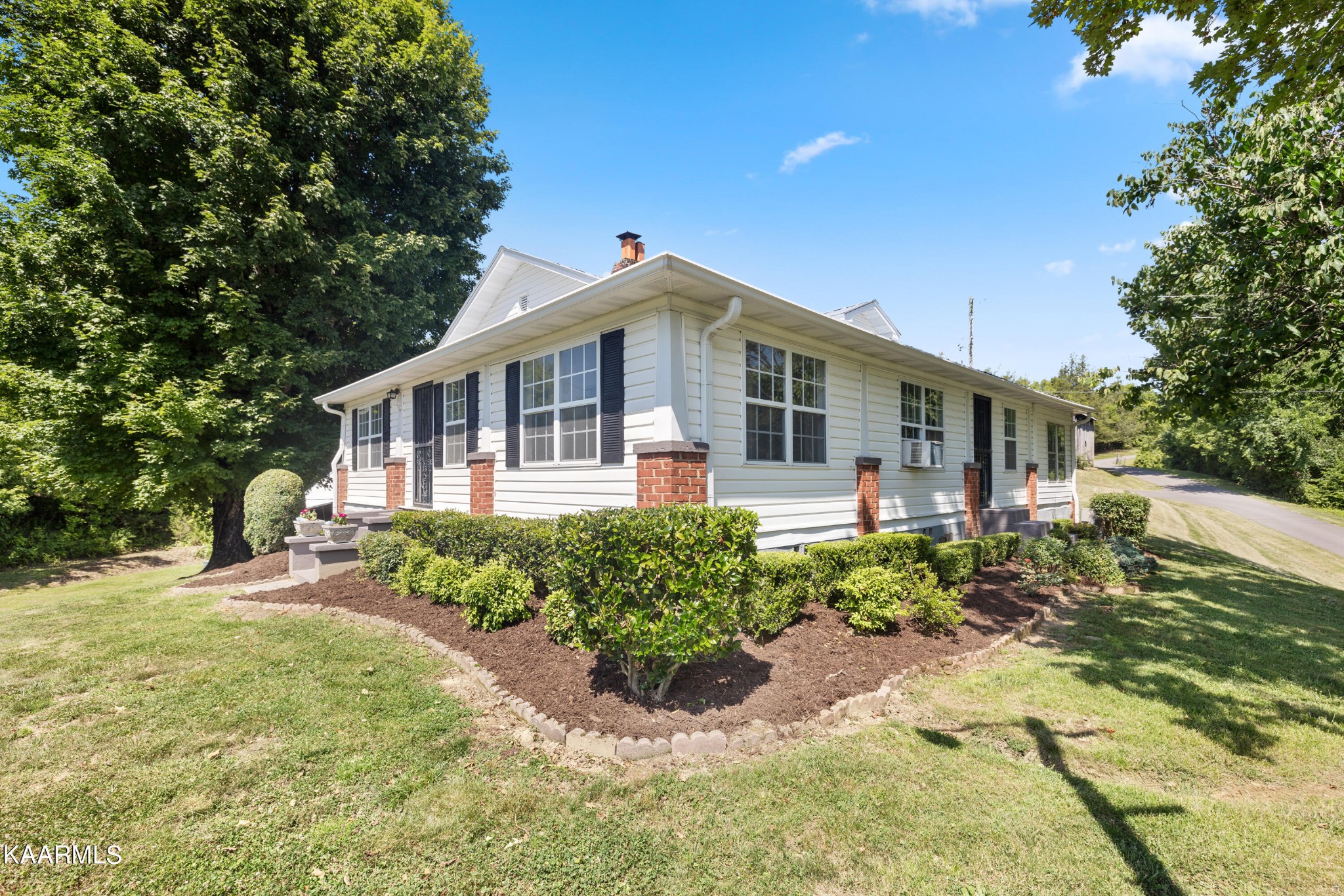 3044 Sims Road Sevierville, TN 37876 - Photo 5 of 34 a front view of a house with a yard