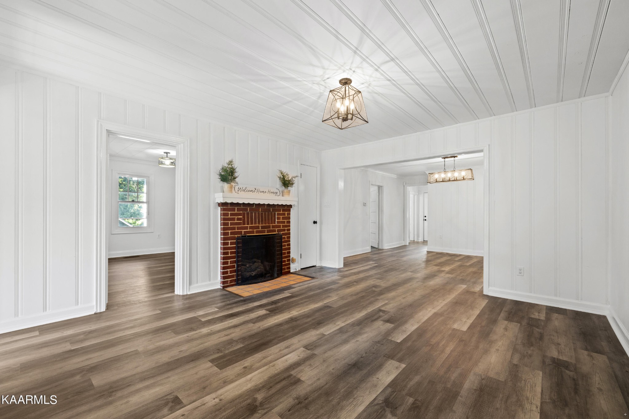 3044 Sims Road Sevierville, TN 37876 - Photo 7 of 34 wooden floor fireplace and natural light in room