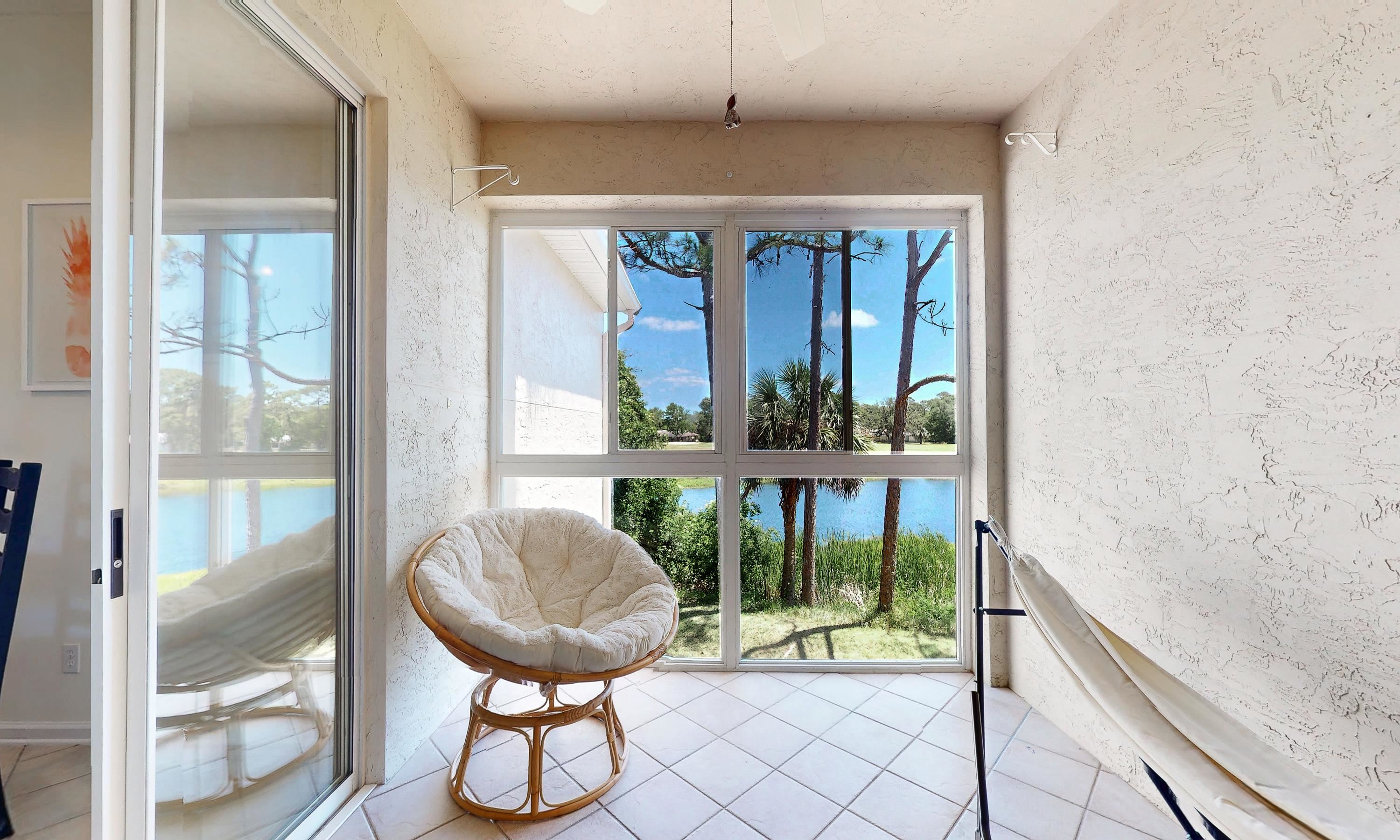 705 Augusta Circle St. Augustine, FL 32086 - Photo 19 of 52 a view of a room with a large window and wooden floor