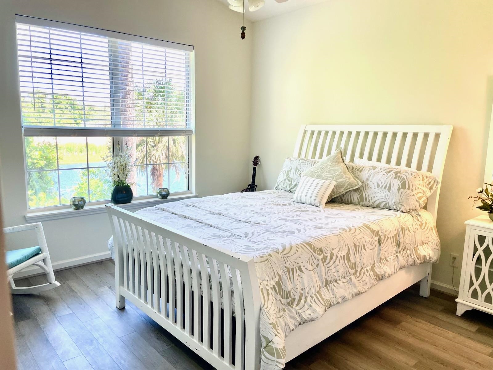 705 Augusta Circle St. Augustine, FL 32086 - Photo 21 of 52 a bedroom with a bed and a window