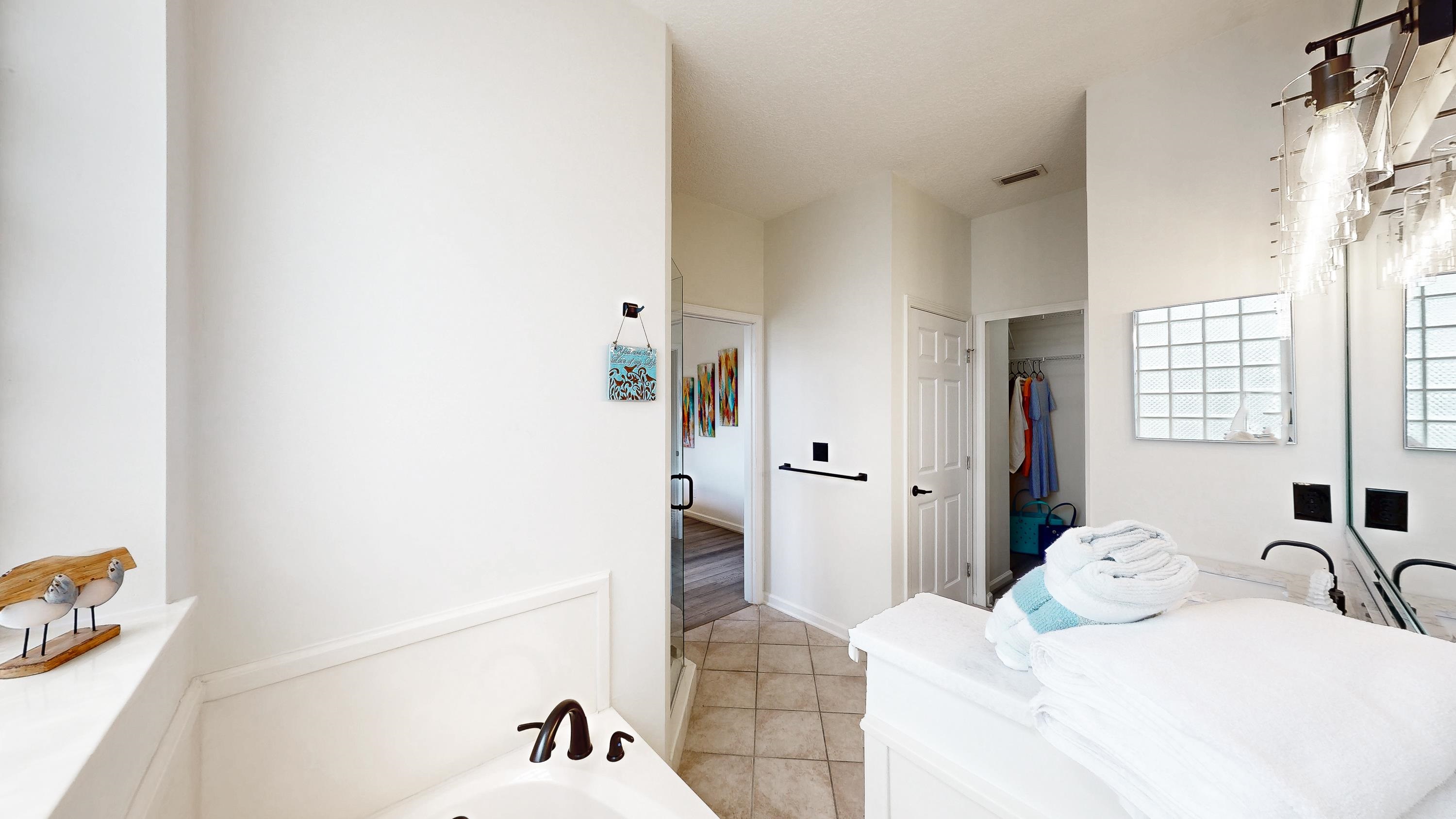 705 Augusta Circle St. Augustine, FL 32086 - Photo 23 of 52 a bedroom with a bed and a large mirror on the dresser