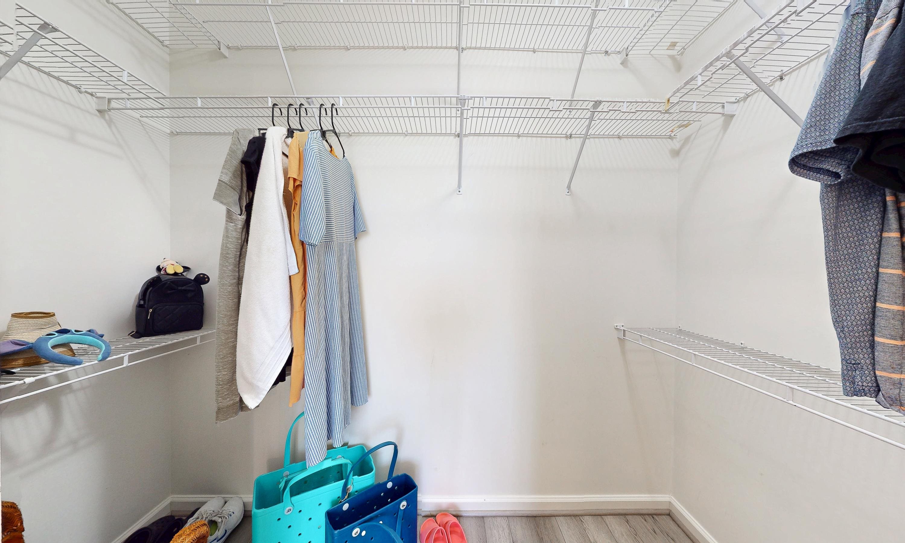 705 Augusta Circle St. Augustine, FL 32086 - Photo 24 of 52 a view of walk in closet with clothes and shoes