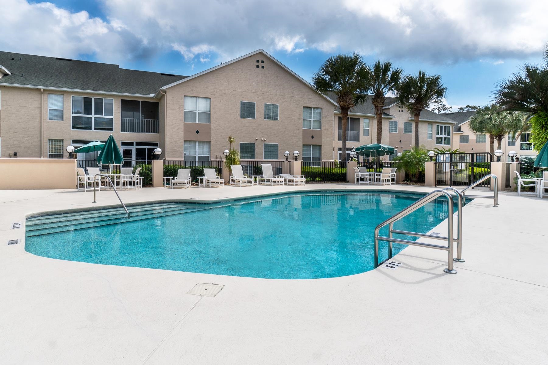 705 Augusta Circle St. Augustine, FL 32086 - Photo 34 of 52 a view of a house with pool and chairs