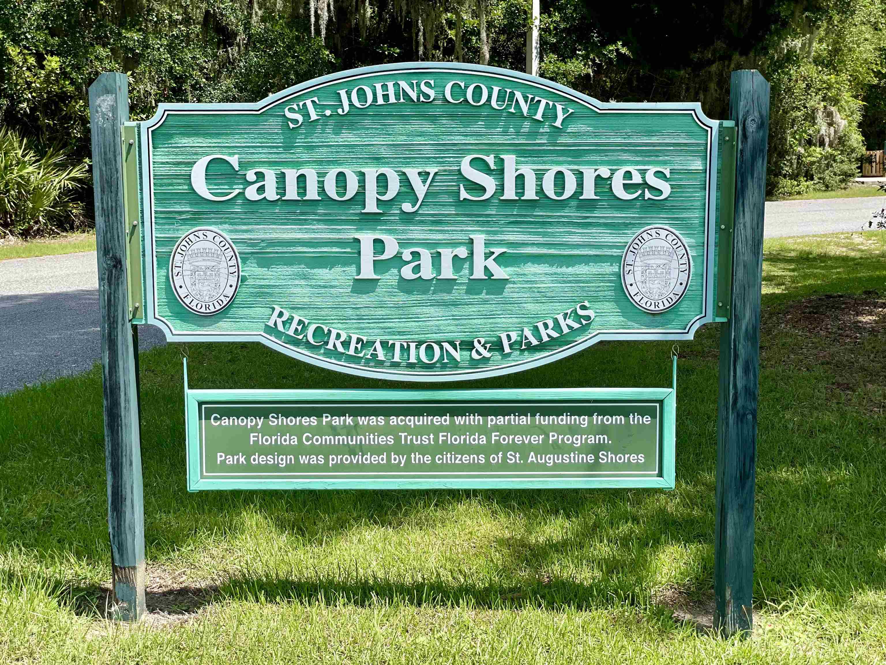 705 Augusta Circle St. Augustine, FL 32086 - Photo 43 of 52 a sign that is sitting on a lush green area