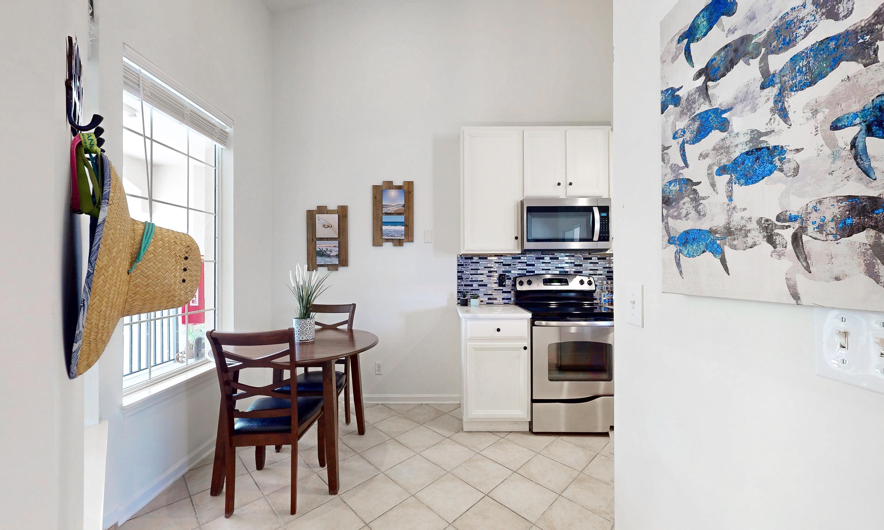 705 Augusta Circle St. Augustine, FL 32086 - Photo 7 of 52 a kitchen with stainless steel appliances a stove a sink and a refrigerator