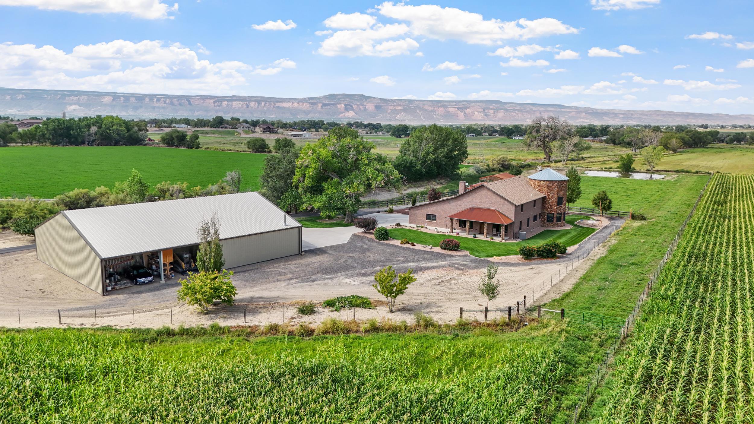 an aerial view of a house with garden space and street view
