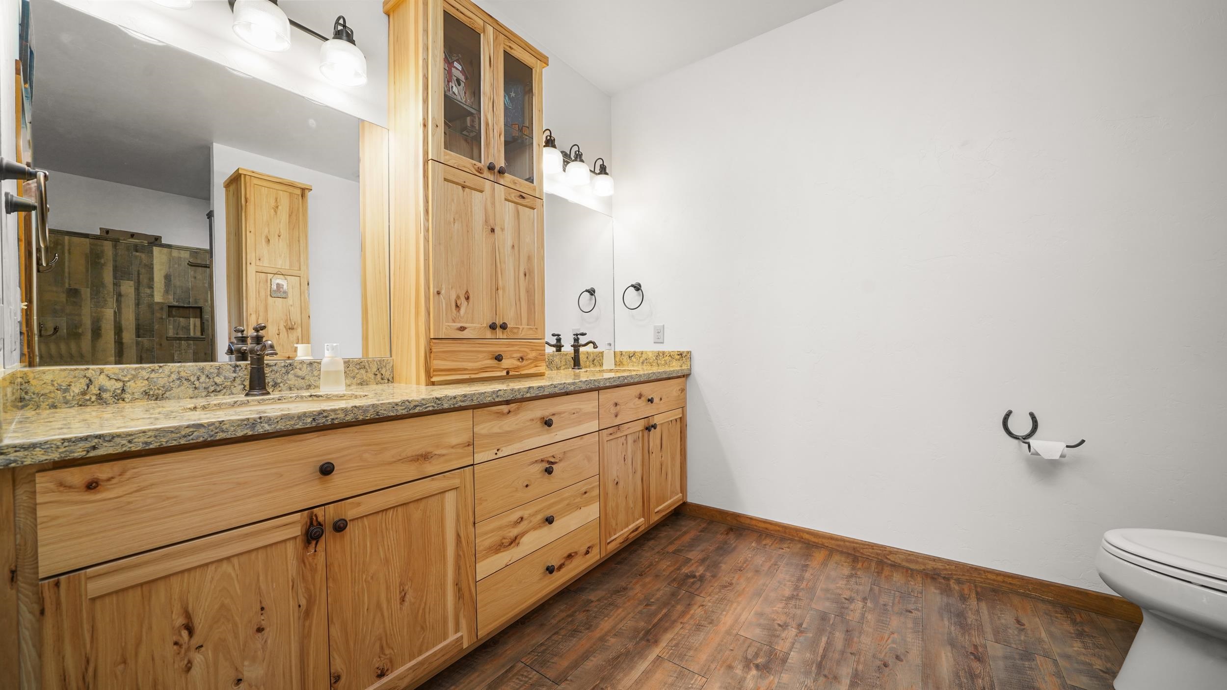 1029 25 Road Grand Junction, CO 81505 - Photo 25 of 41 a bathroom with a granite countertop sink mirror and toilet