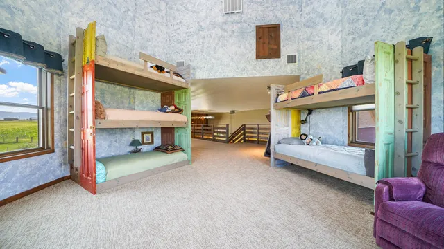 a view of a livingroom with furniture and a flat screen tv