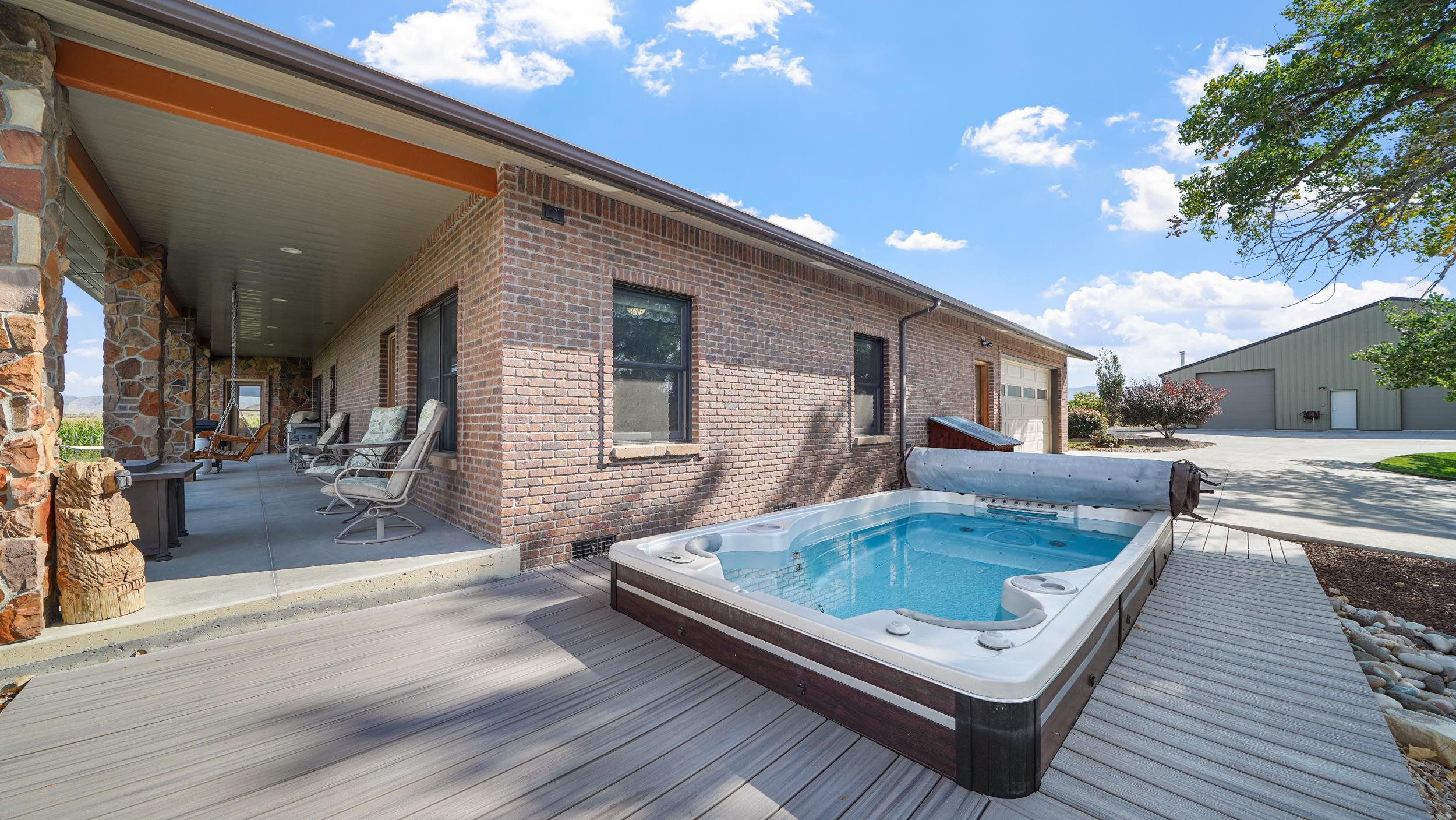 1029 25 Road Grand Junction, CO 81505 - Photo 37 of 42 a view of a couches and dinning table in patio