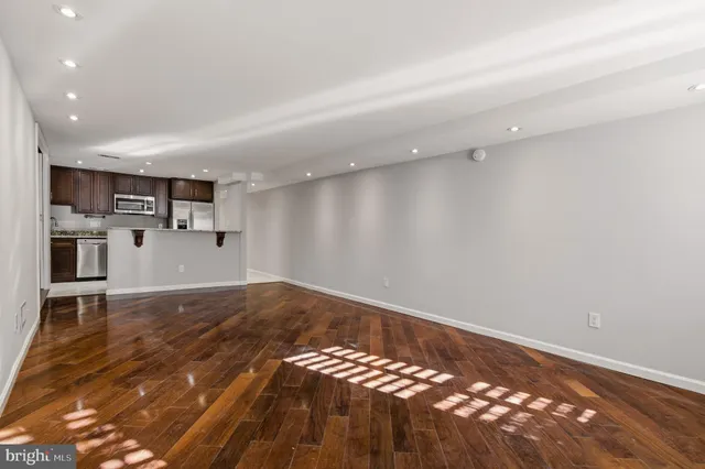 a view of a dining room with furniture kitchen and wooden floor