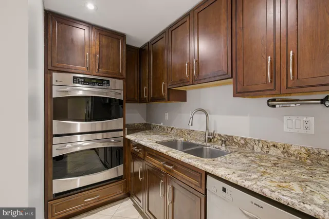 a view of a livingroom with workspace and a couch