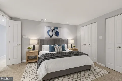 a white toilet sitting next to a shower curtain