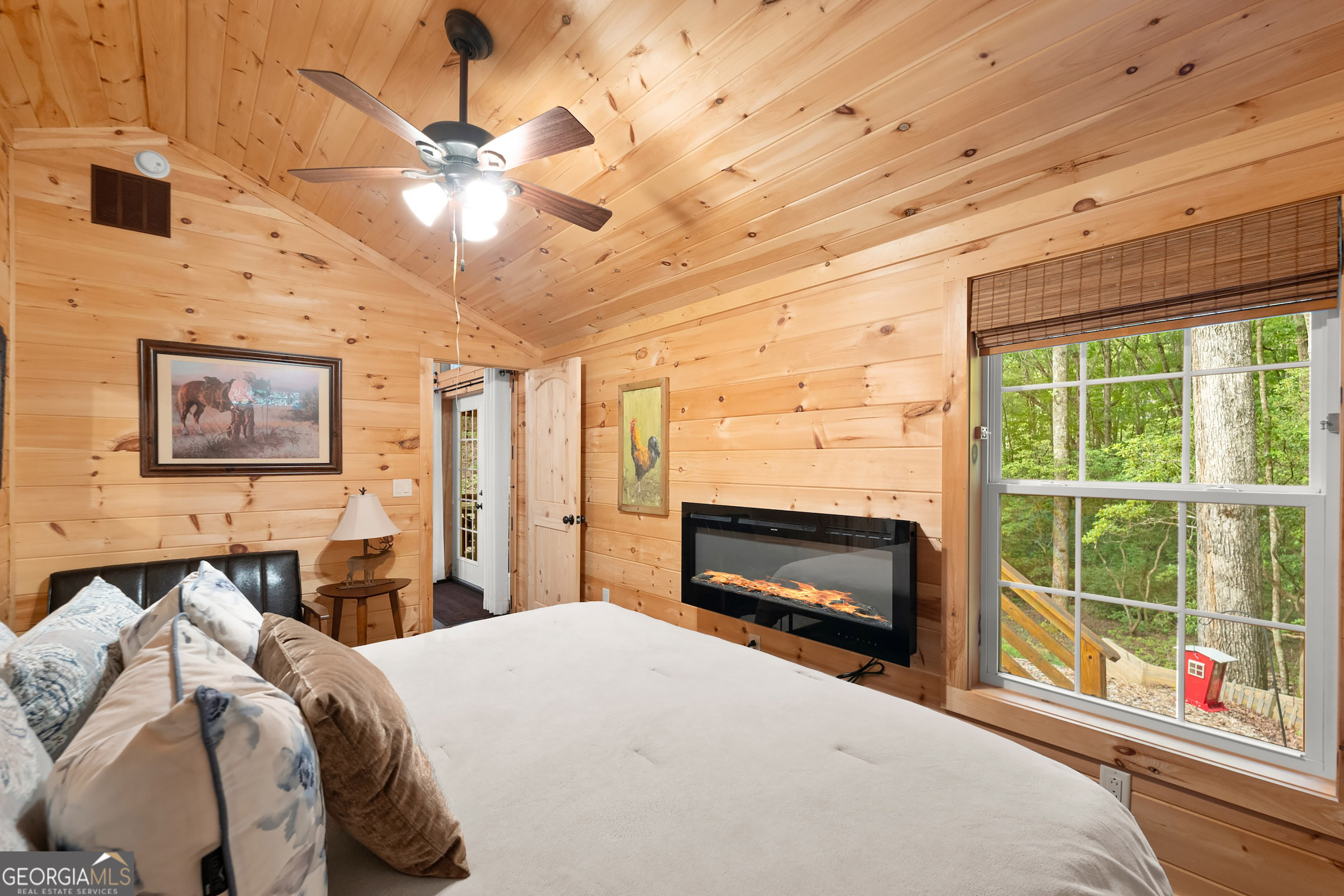 3103 Highway 197 Clarkesville, GA 30523 - Photo 18 of 30 a bedroom with a bed and a fireplace