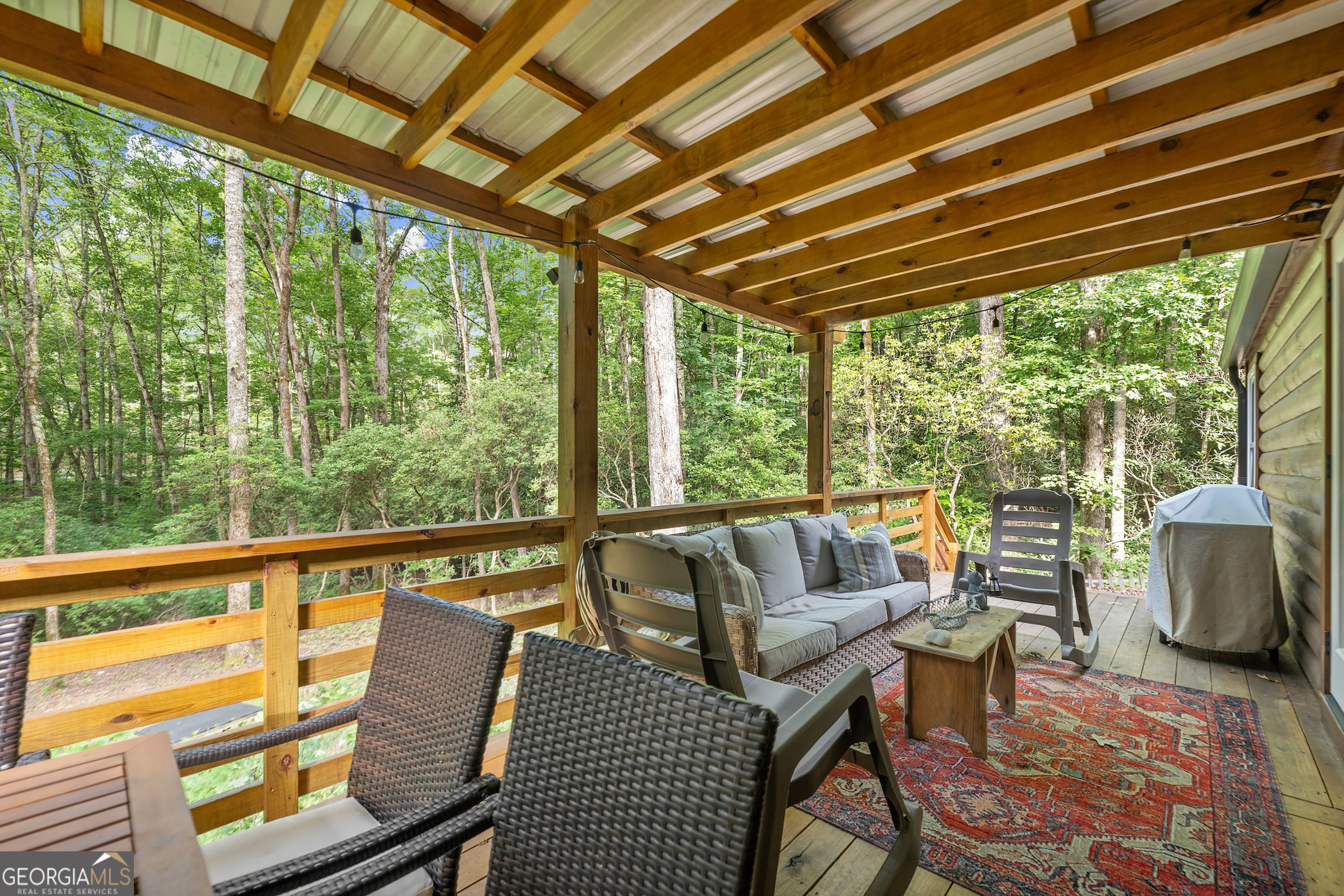 3103 Highway 197 Clarkesville, GA 30523 - Photo 25 of 30 a balcony with furniture and wooden floor