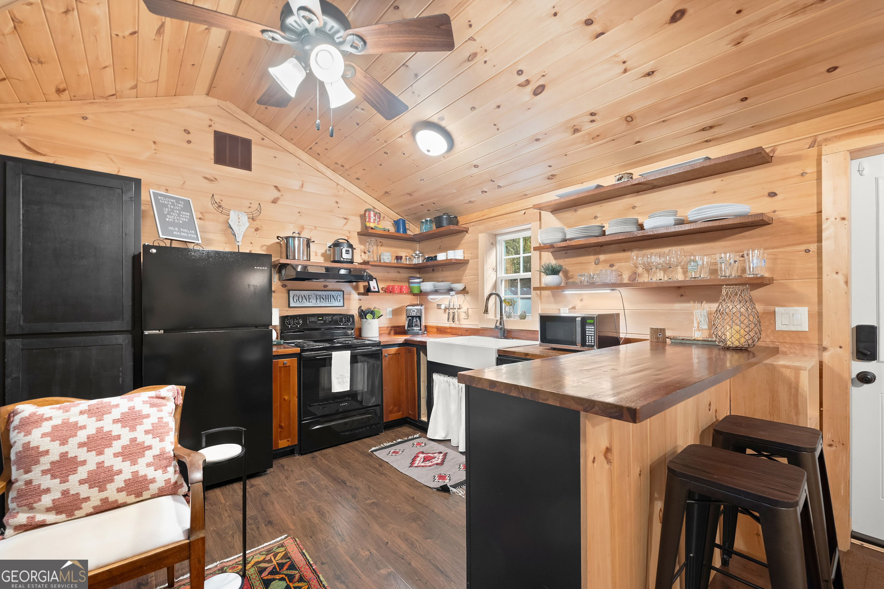 3103 Highway 197 Clarkesville, GA 30523 - Photo 9 of 30 a kitchen with stainless steel appliances granite countertop a sink and a refrigerator