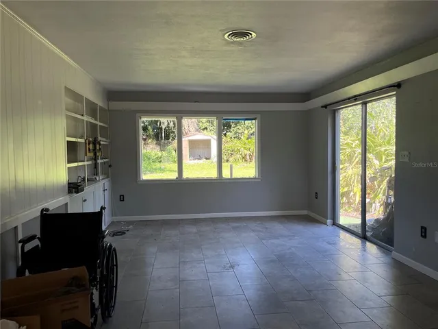 a view of an empty room with a window