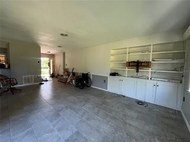 a view of a room with cabinet dryer and washer