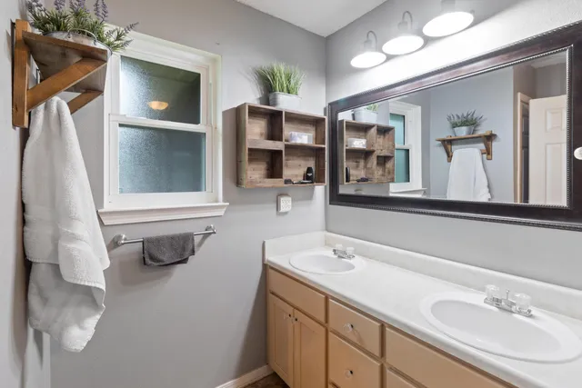 a bathroom with a sink and a mirror