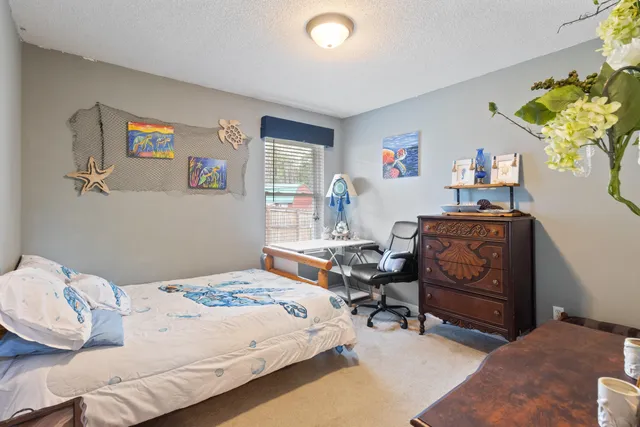 a bedroom with a bed and a couch