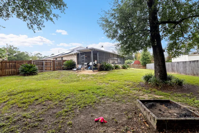 a view of a house with a yard and garage