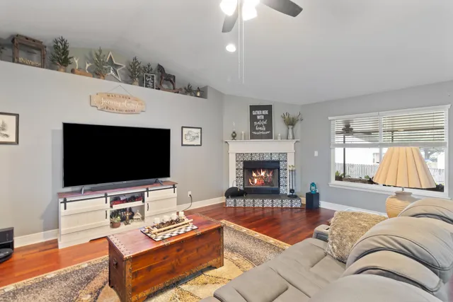 a living room with furniture and a flat screen tv