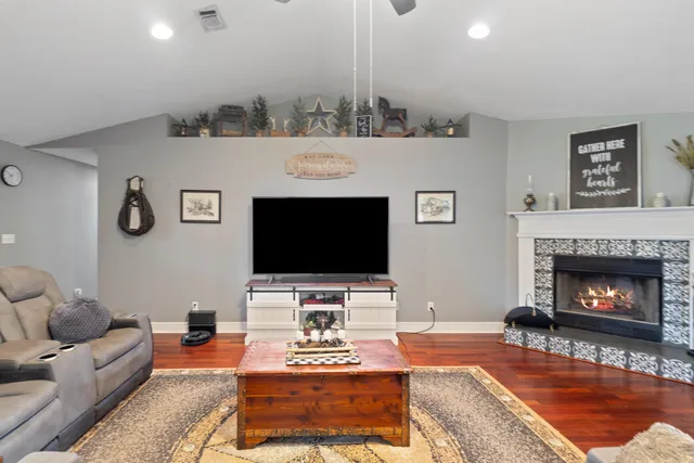 a living room with furniture and a fireplace