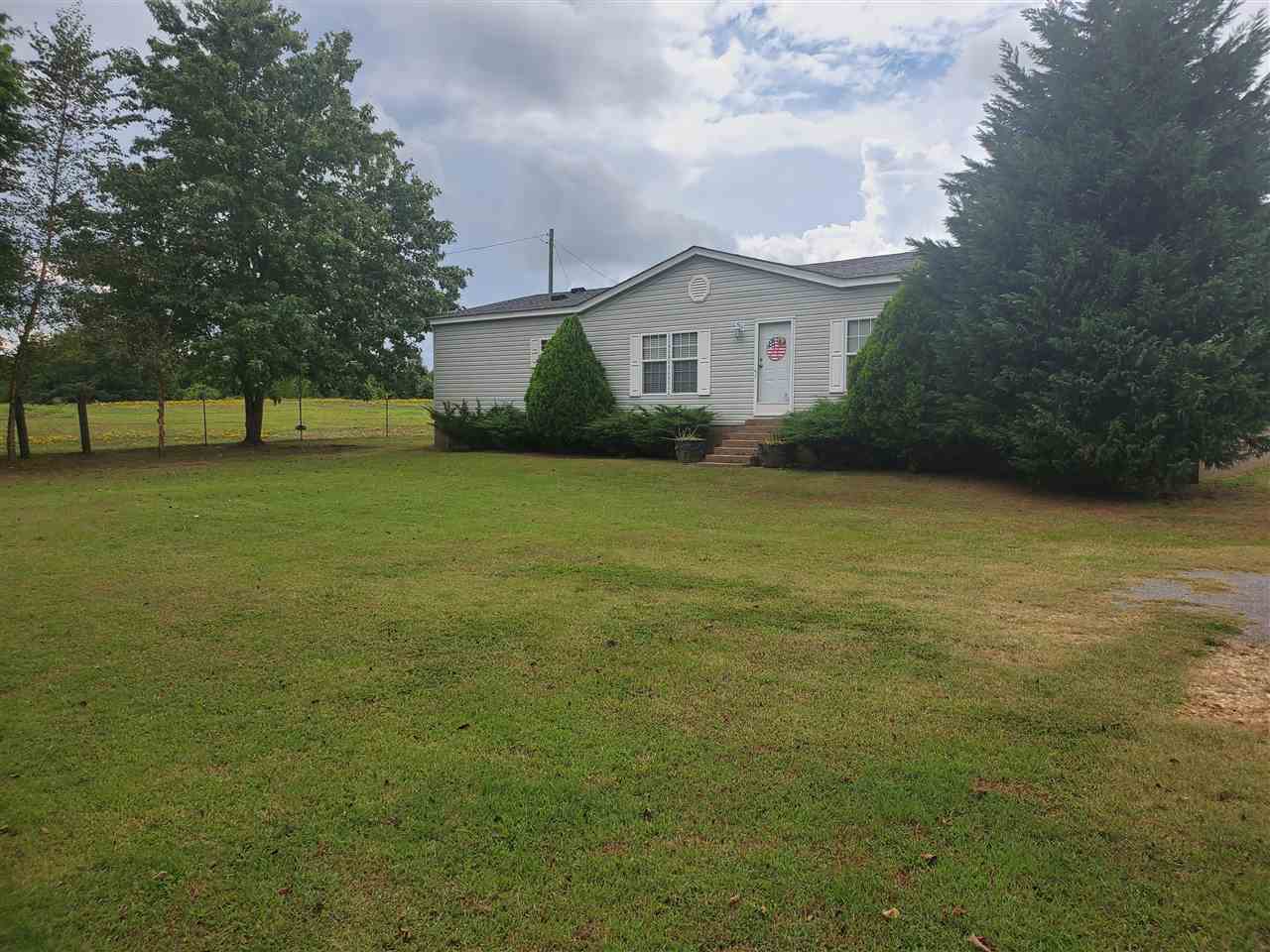 8251 Edith-Nankipoo Road Ripley, TN 38063 - Photo 2 of 17 a front view of house with yard and trees