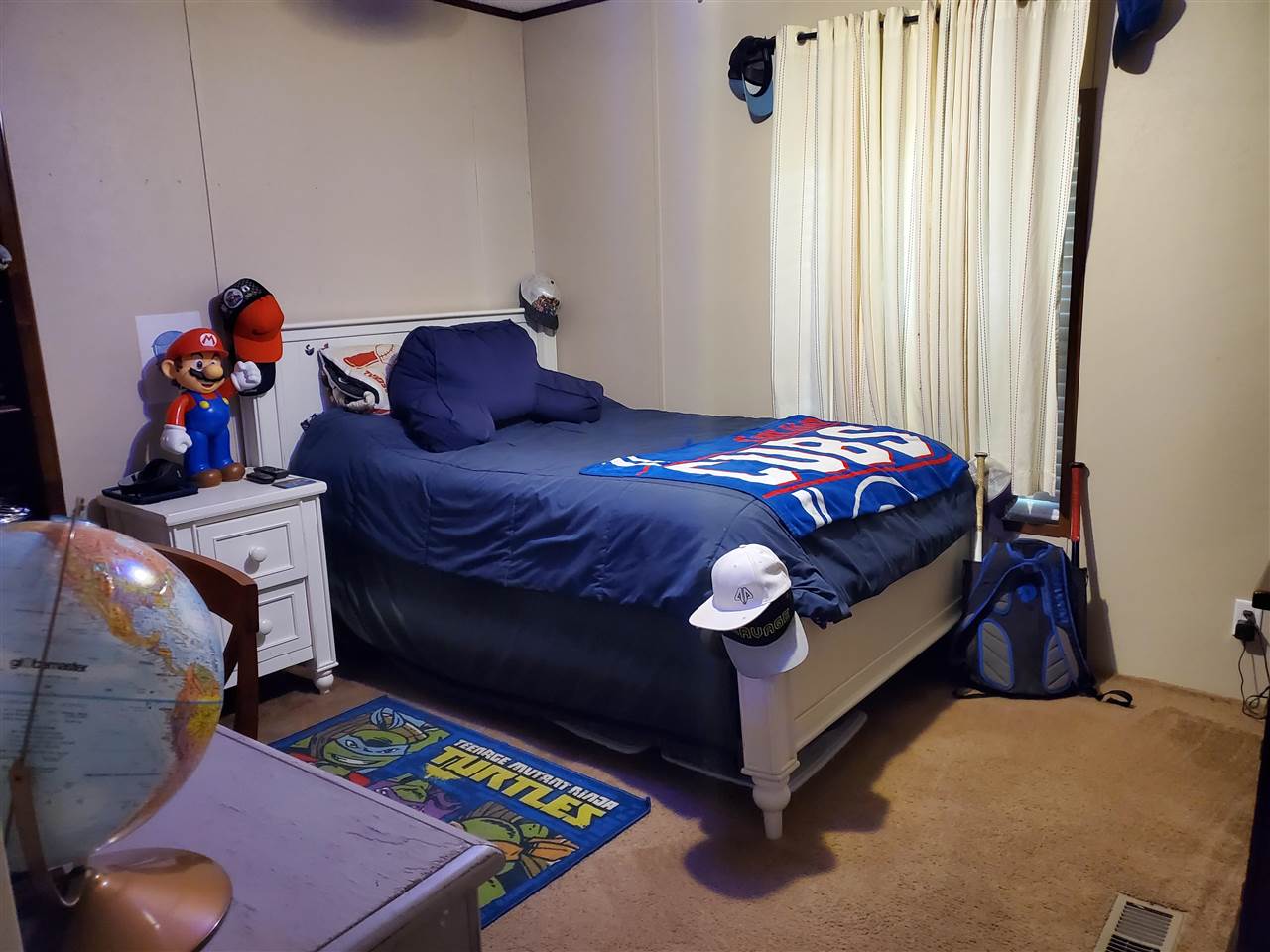 8251 Edith-Nankipoo Road Ripley, TN 38063 - Photo 12 of 17 a bed sitting in a bedroom next to a window