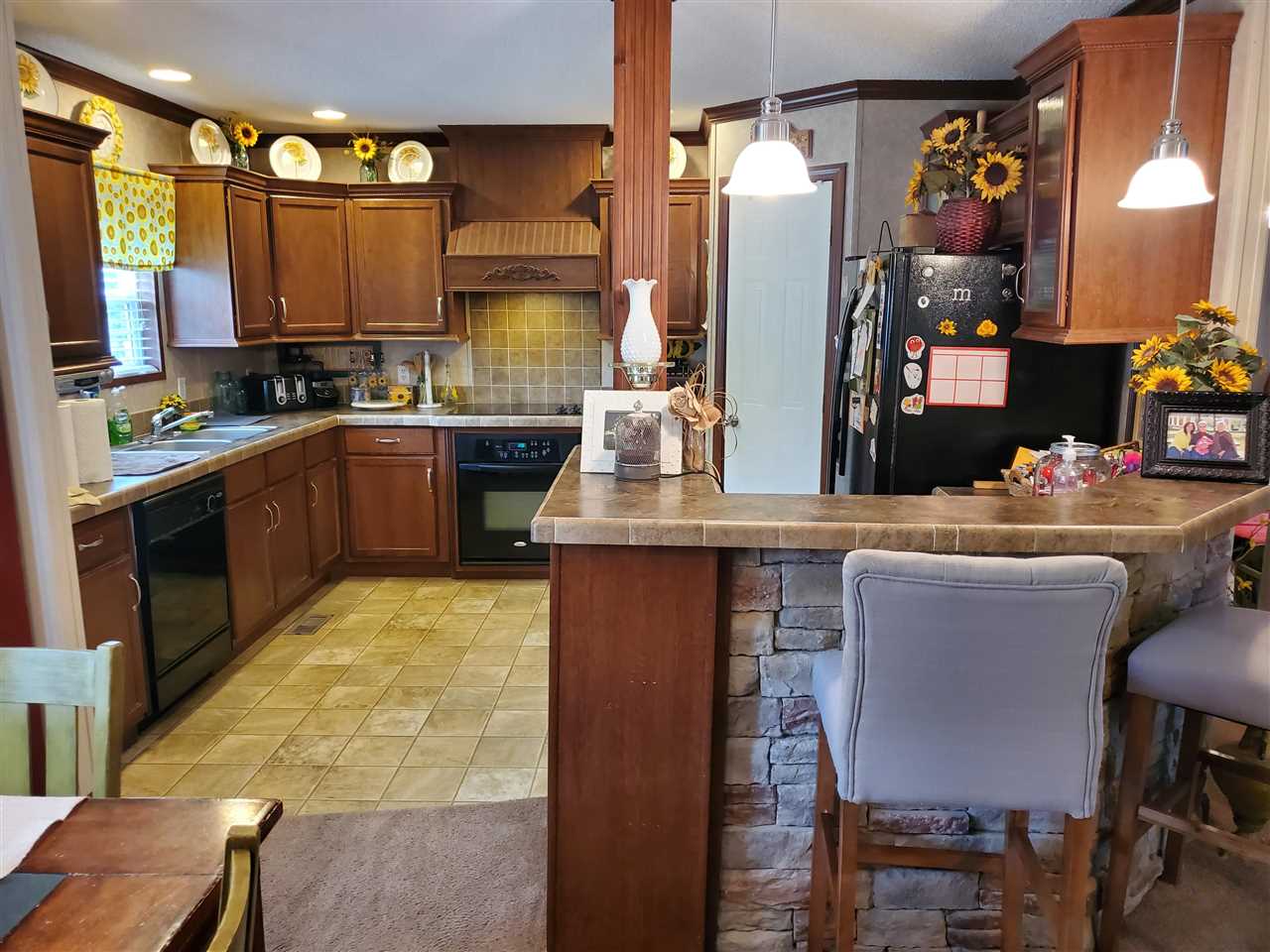 8251 Edith-Nankipoo Road Ripley, TN 38063 - Photo 6 of 17 a kitchen with stainless steel appliances granite countertop a sink and cabinets