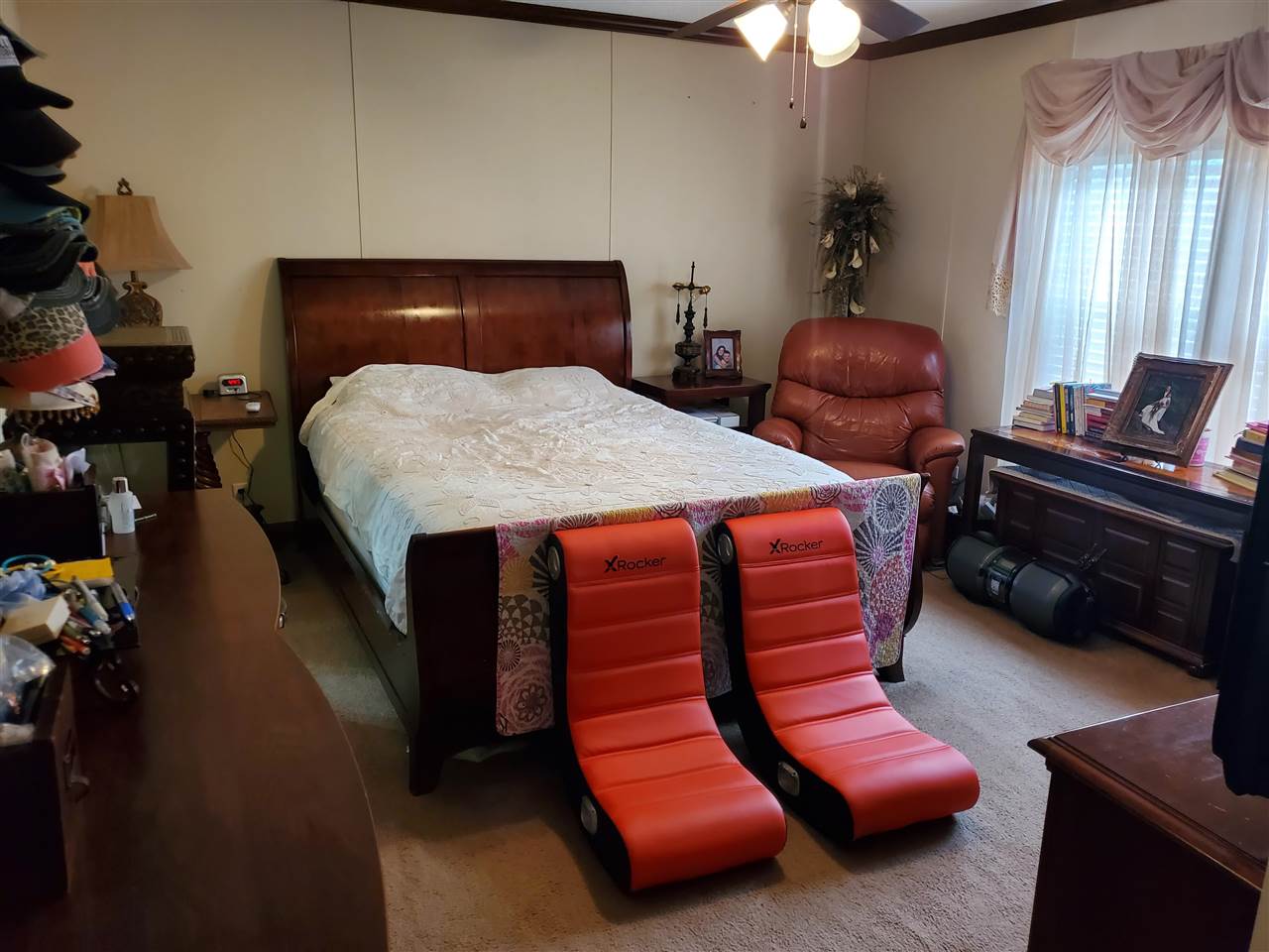 8251 Edith-Nankipoo Road Ripley, TN 38063 - Photo 8 of 17 a bedroom with a bed and a chandelier