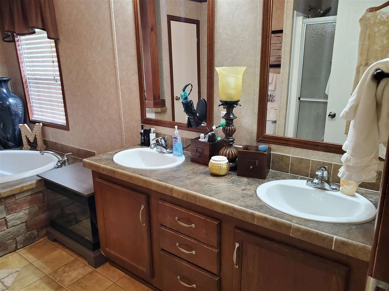 8251 Edith-Nankipoo Road Ripley, TN 38063 - Photo 9 of 17 a bathroom with double sink and a mirror