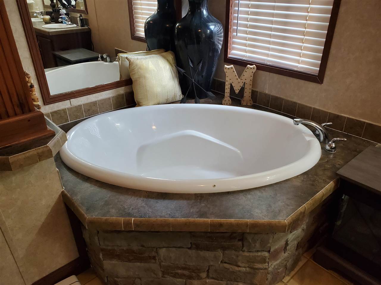 8251 Edith-Nankipoo Road Ripley, TN 38063 - Photo 10 of 17 a bathroom with a sink and a mirror