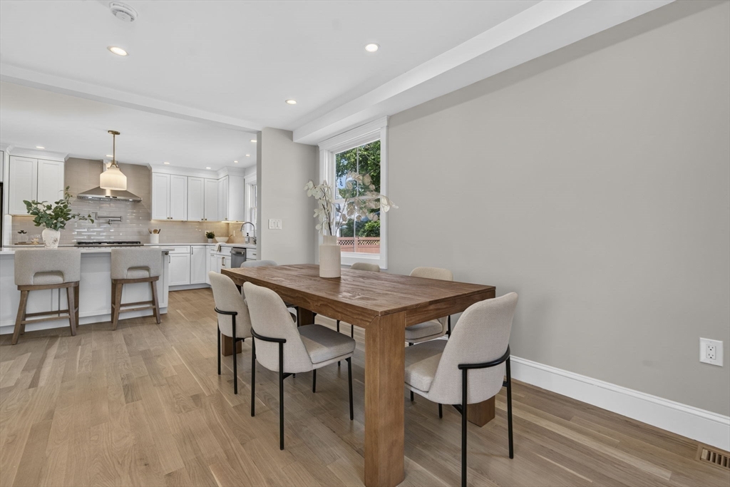 20 Saltonstall Road Medford, MA 02155 - Photo 7 of 41 a view of a dining room with furniture and wooden floor
