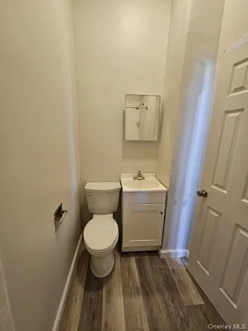 a bathroom with a toilet and a sink