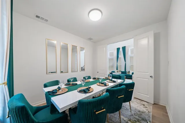 a view of a dining room with furniture