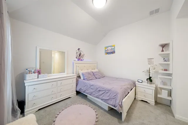 a bedroom with a bed and a closet